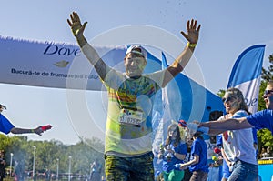 Runner sprayed with blue powder